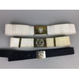 A MILITARY BELT WITH GORDON HIGHLANDERS CLASP AND OTHERS