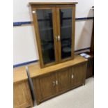 A STAINED WOOD SIDEBOARD AND A MATCHING CUPBOARD