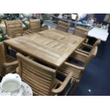 A CONTEMPORARY HARDWOOD EXTENDING GARDEN DINING TABLE AND EIGHT ARMCHAIRS