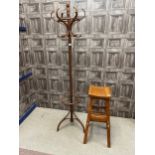 A BENTWOOD STYLE CLOAK TREE AND A STOOL