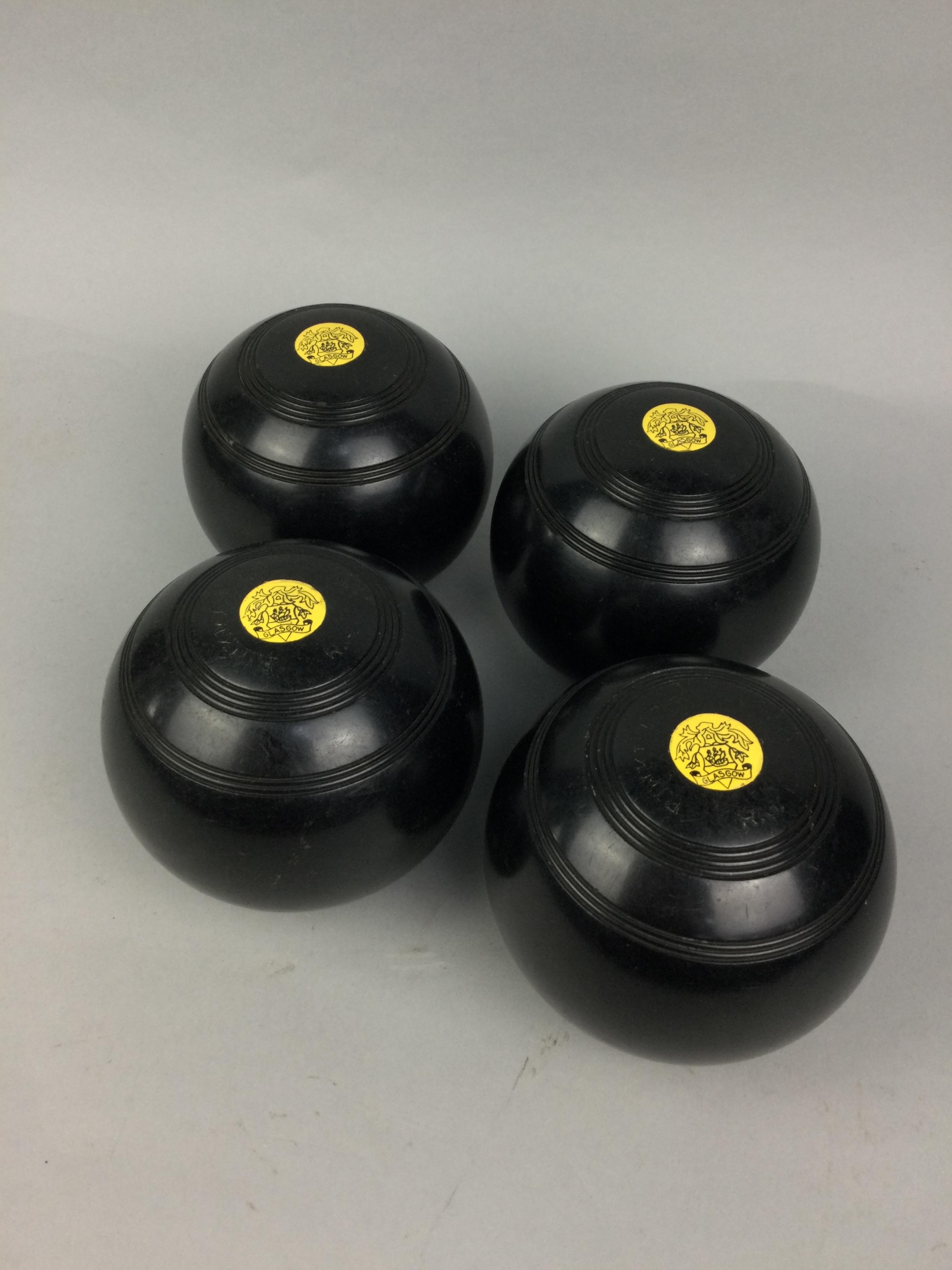 A SET OF LAWN BOWLS