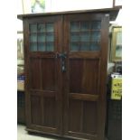 AN ARTS & CRAFTS STYLE ARMOIRE