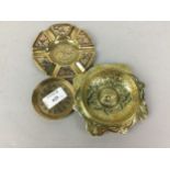 A GROUP OF THREE BRASS ASHTRAYS