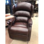 A BROWN LEATHER ELECTRIC ARMCHAIR
