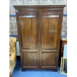 A MAHOGANY TWO DOOR WARDROBE