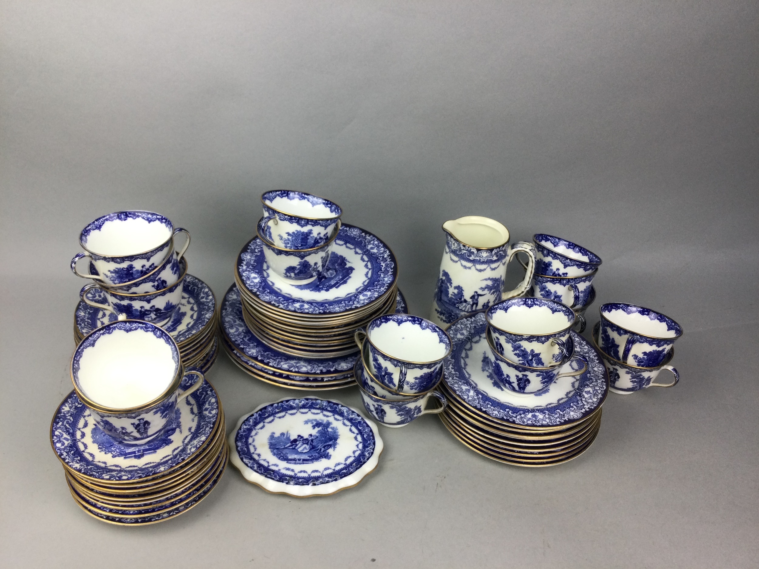 A ROYAL DOULTON AND DOULTON BURSLEM WATTEAU TEA SERVICE