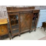 A MAHOGANY THREE DOOR BOOKCASE