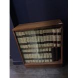 A LOT OF BRITANNICA ENCYCLOPEDIAS IN A RETRO CABINET