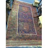 A PERSIAN FRINGED AND BORDERED RUG