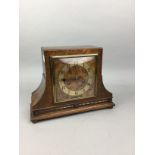 AN OAK CASED MANTEL CLOCK