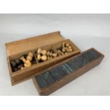 A TURNED WOOD PART CHESS SET AND A SET OF VINTAGE DOMINOES