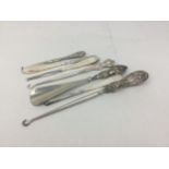 A LOT OF SILVER HANDLED SEWING TOOLS