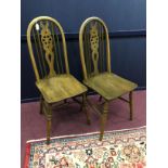 A SET OF SIX ERCOL SPINDLE BACK DINING CHAIRS