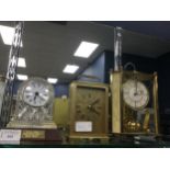 A CUT GLASS MANTLE CLOCK, A CARRIAGE CLOCK AND AN ANNIVERSARY CLOCK