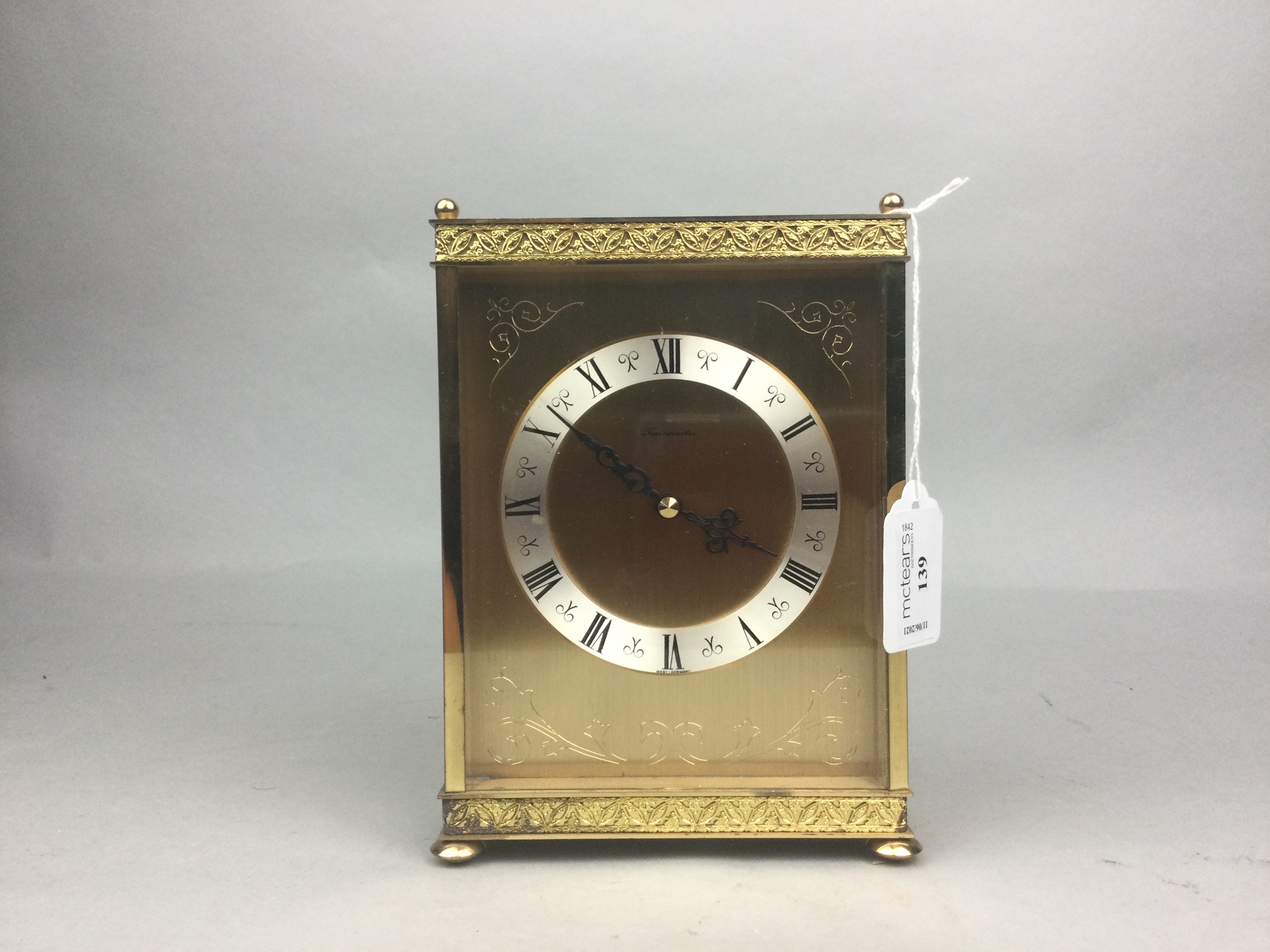 A TIMEMASTER GILT MANTEL CLOCK AND ANOTHER