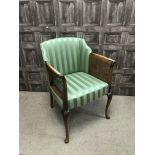 AN EARLY 20TH CENTURY CANE PANELLED ARMCHAIR