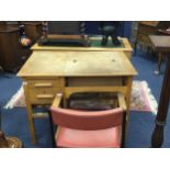 AN OAK OFFICE DESK AND A SWIVEL CHAIR