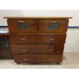 AN ARTS & CRAFTS STYLE CHEST OF DRAWERS