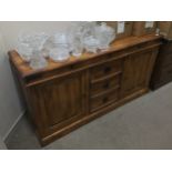 A STAINED WOOD SIDEBOARD