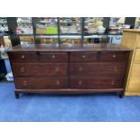 A STAG CHEST OF DRAWERS AND A STAG OPEN BOOKCASE