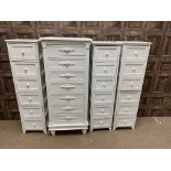 A LOT OF FOUR MODERN WHITE PAINTED UPRIGHT CHESTS