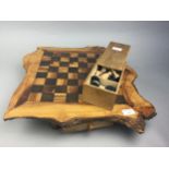 A WOODEN GAMES BOARD WITH CHESS AND DRAUGHTS