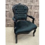 A BLACK PAINTED ARMCHAIR OF FRENCH DESIGN