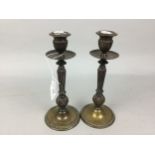 A PAIR OF BRASS CANDLESTICKS