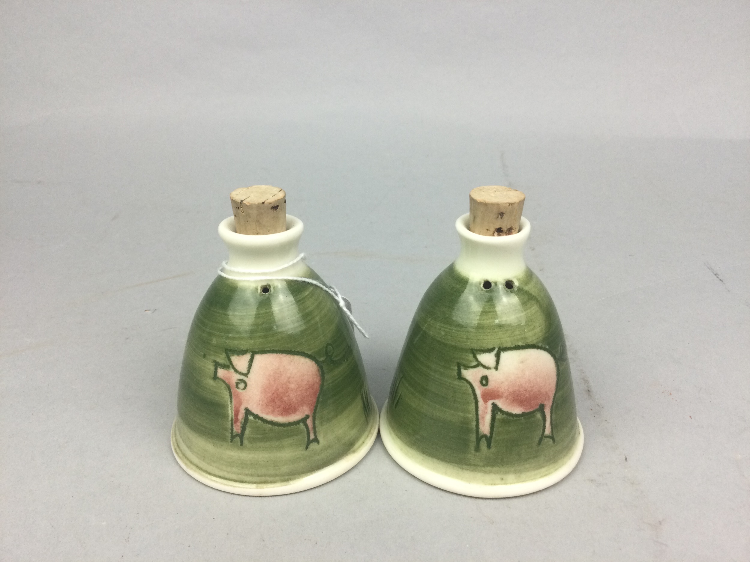 A PAIR OF NIAMH HYNES STUDIO POTTERY SHAKERS