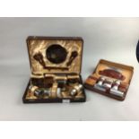 A SIMULATED TORTOISESHELL VANITY SET IN FITTED CASE AND ANOTHER