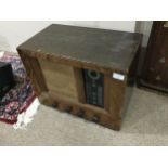 A VINTAGE RADIO IN WALNUT CASE