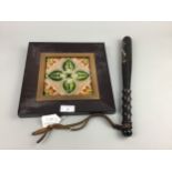 A VINTAGE POLICE TRUNCHEON AND A CERAMIC TILE