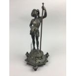 A LATE VICTORIAN CAST BRASS FIGURE