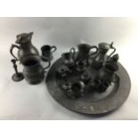 AN EARLY 19TH CENTURY PEWTER CHARGER, JUGS AND MEASURES