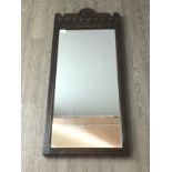 A VICTORIAN OAK FRAMED OBLONG WALL MIRROR