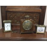 A BRASS CARRIAGE CLOCK, TWO OTHER MANTEL CLOCKS AND A BAROMETER