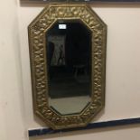 AN EARLY 20TH CENTURY BRASS FRAMED WALL MIRROR