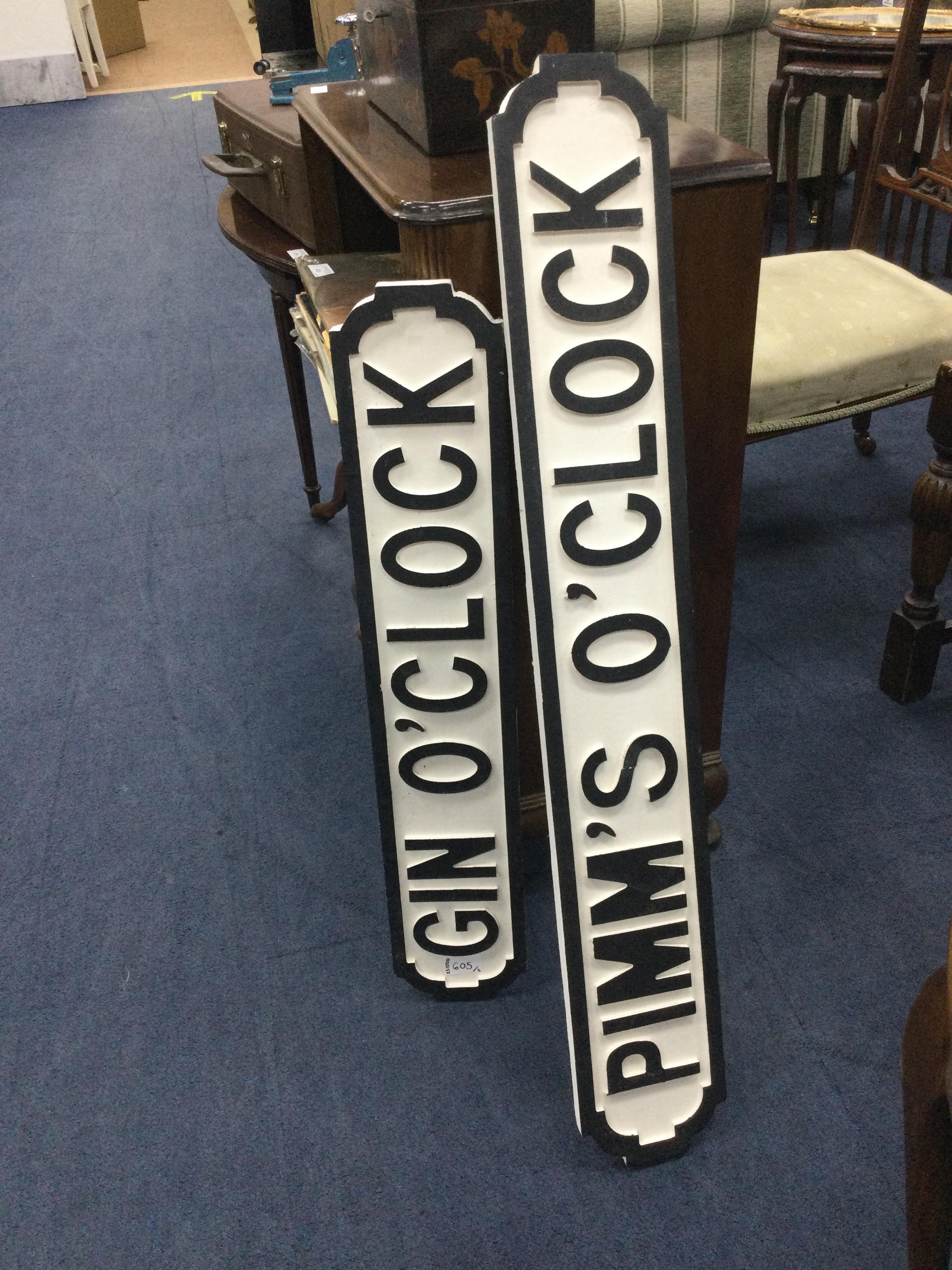 GIN O'CLOCK, A PAINTED WOOD STREET SIGN STYLE PLAQUE AND A PIMM'S O'CLOCK SIGN