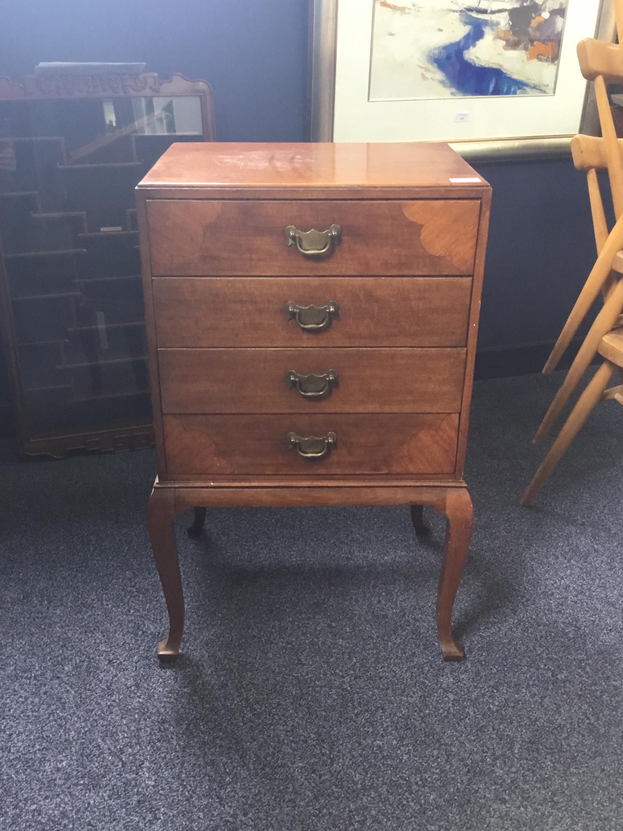 AN EARLY 20TH CENTURY FOUR DRAWER MUSIC CABINET