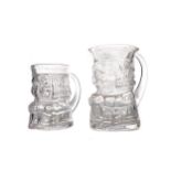 A PAIR OF LATE VICTORIAN GRADUATED GLASS CHARACTER JUGS