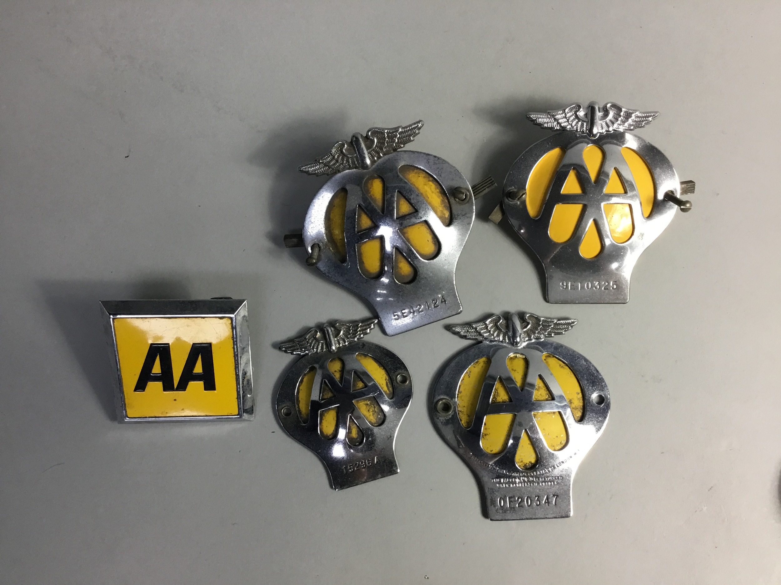 A COLLECTION OF AA CAR BADGES