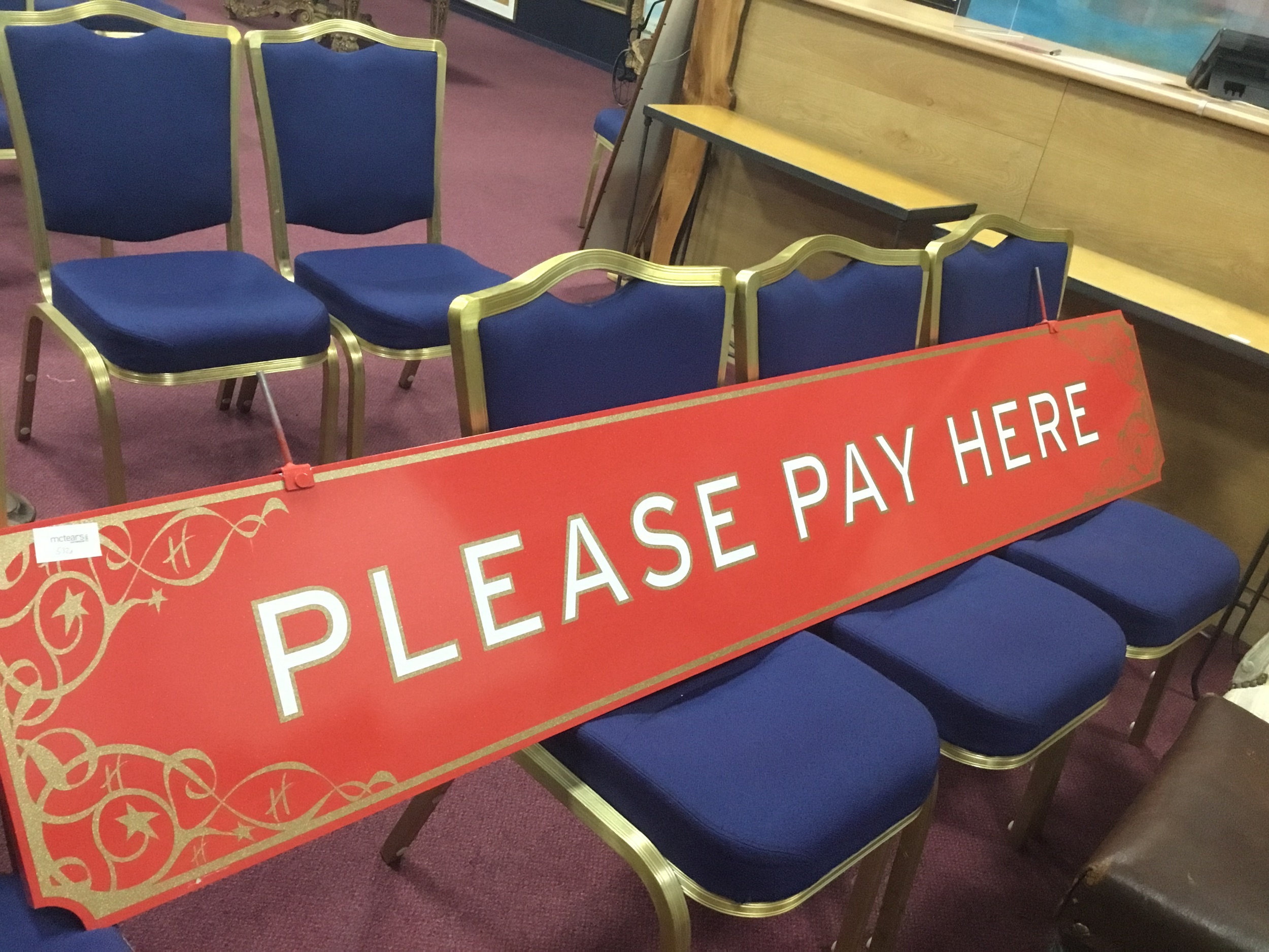 A LARGE 'PLEASE PAY HERE' SIGN FROM HAMLEY'S LONDON