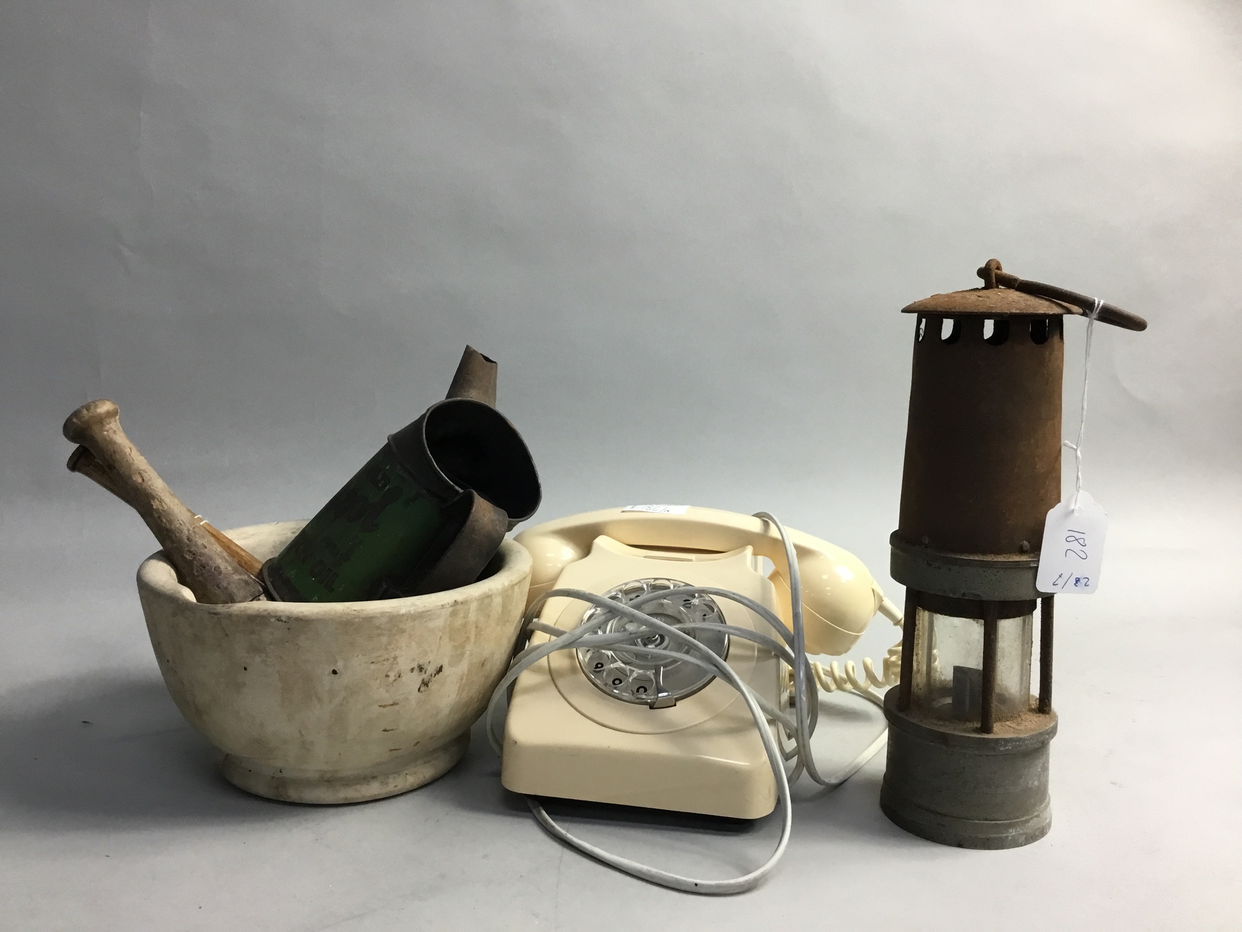 A MINER'S LAMP ALONG WITH OTHER VINTAGE ITEMS