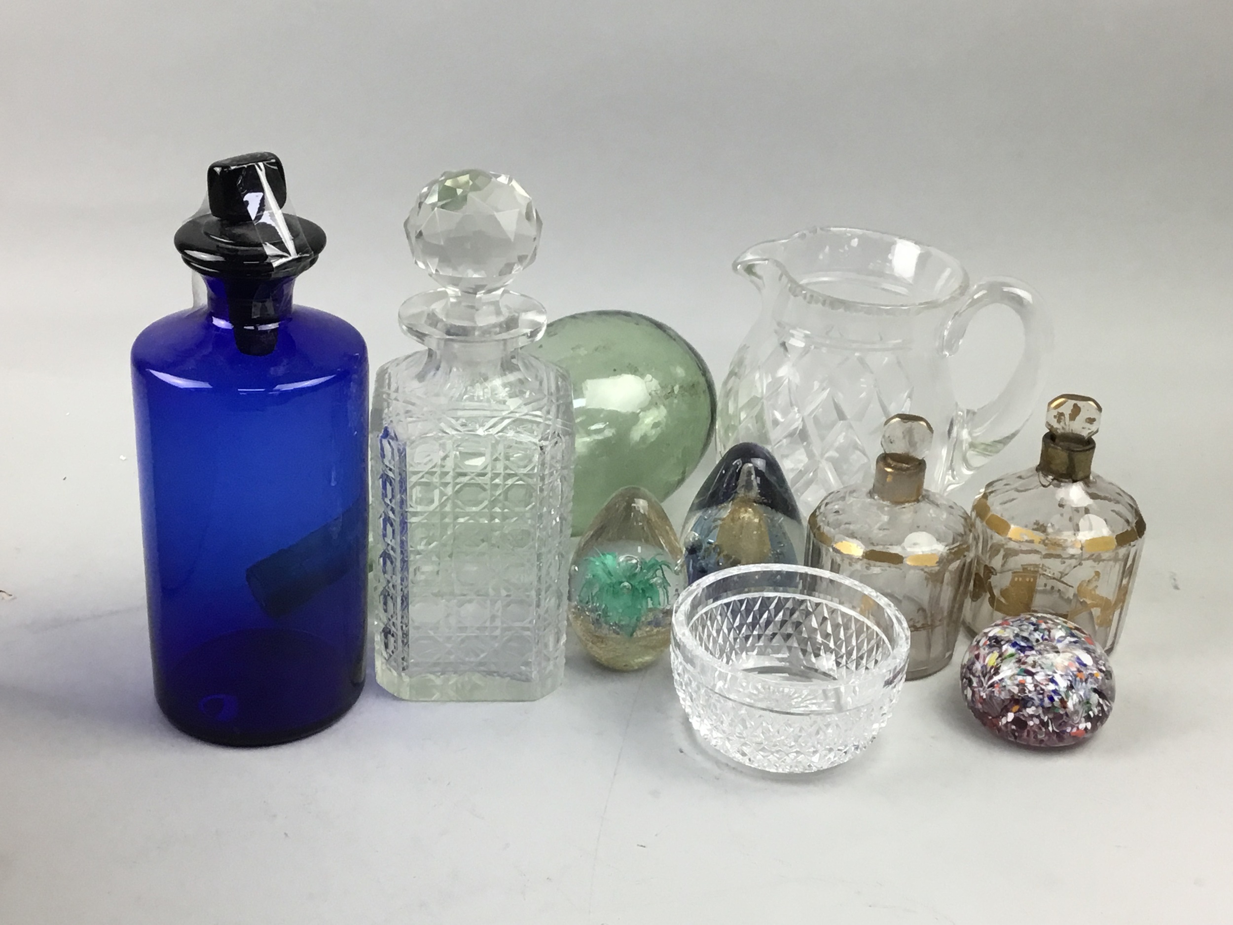 A LOT OF CLEAR AND COLOURED GLASS INCLUDING PAPERWEIGHTS