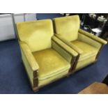 A PAIR OF UPHOLSTERED ARM CHAIRS
