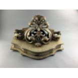 A CREAM AND GILT PAINTED CARVED WOOD WALL BRACKET