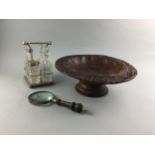 A GLASS AND SILVER PLATED CRUET STAND, A MAGNIFYING GLASS AND A TAZZA