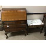 A MAHOGANY BUREAU AND AN OAK DRESSING STOOL