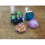 FOUR GLASS PAPERWEIGHTS