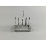 A SILVER FOUR DIVISION LANCET ARCHED TOAST RACK